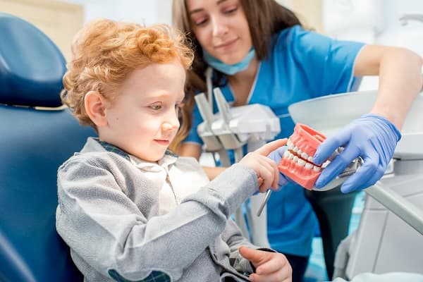 Happy child smiling during a pediatric dental visit at Meadowbrook Dental